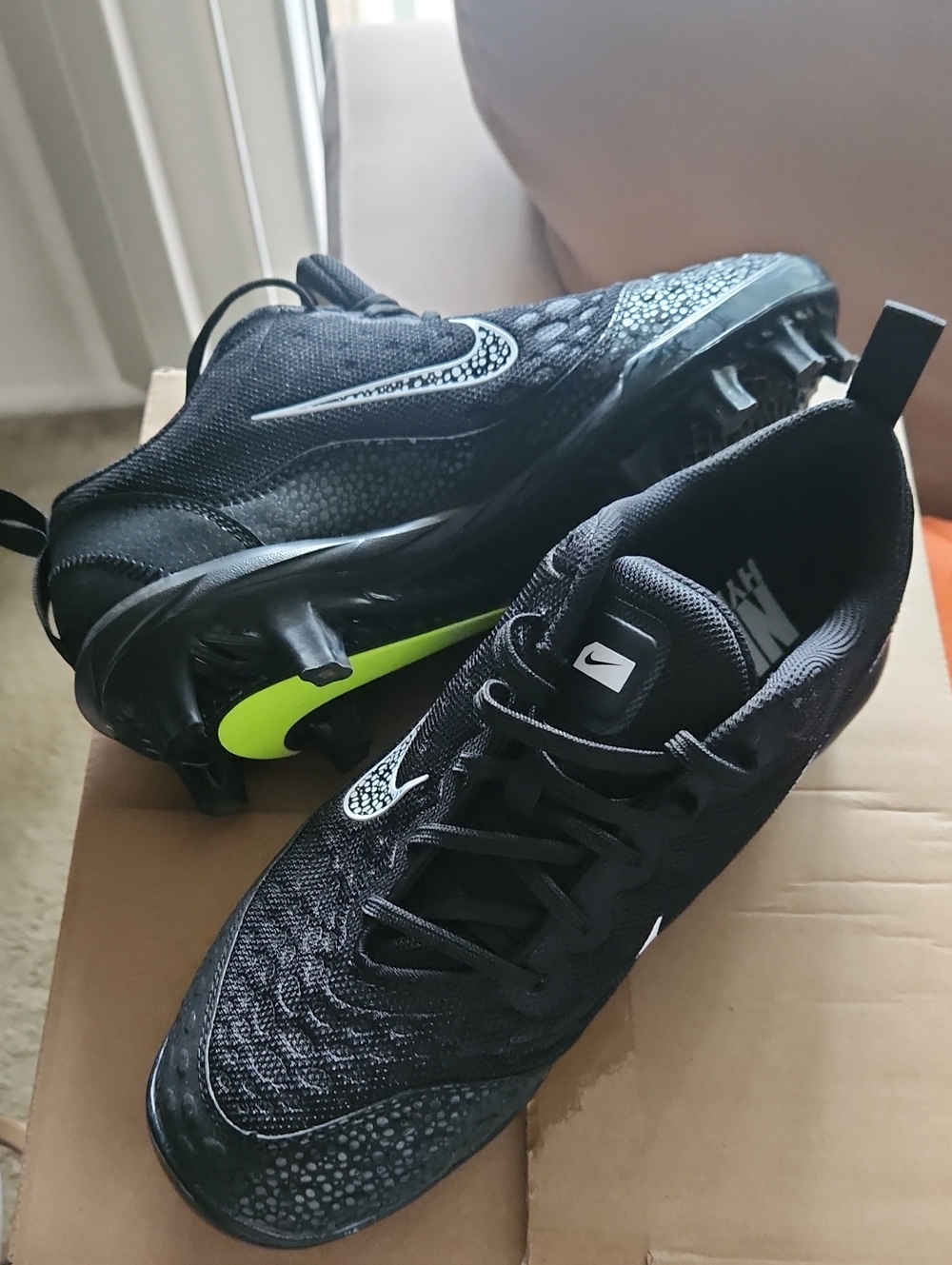 Nike Womenβs Black Cleats with Neon Yellow Accent